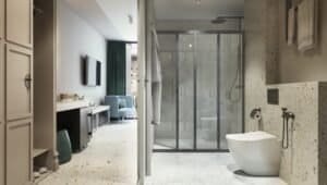 Interior de suite d'hotel moderna: bany obert amb dutxa i lavabo